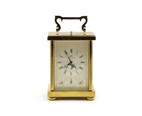 A modern brass carriage clock, Swiss made, dial inscribed 'Matthew Norman', striking the half hours on a gong, with subsidiar