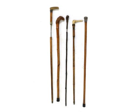 Five various 19th century walking sticks, comprising three with concealed sword blades, one with carved horn head handle, a b