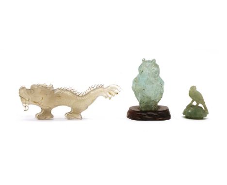 A Chinese agate carving, of a dragon, 11cm long, an owl, 5.5cm high, wood stand, and a jade cover, with a bird finial, 3.7cm 