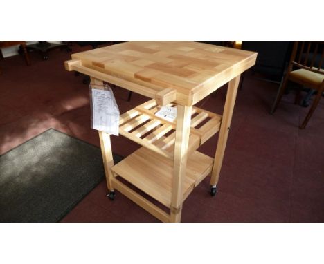 Modern butchers block type kitchen table in light wood finish
