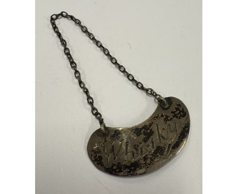 A kidney-shaped whisky noggin decanter label. London 1910. Approx. 3 grams. Est. £20 - £30.
