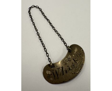 A kidney-shaped whisky noggin decanter label. London 1910. Approx. 3 grams. Est. £20 - £30.