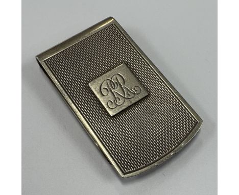 A silver money clip. London 1976. By SJR. Approx. 23 grams. Est. £20 - £30.