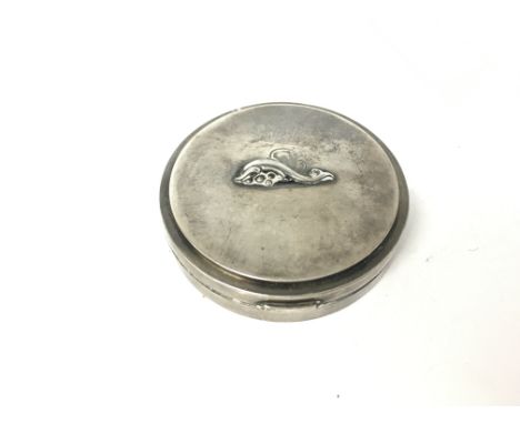 A George Jensen sterling silver compact.