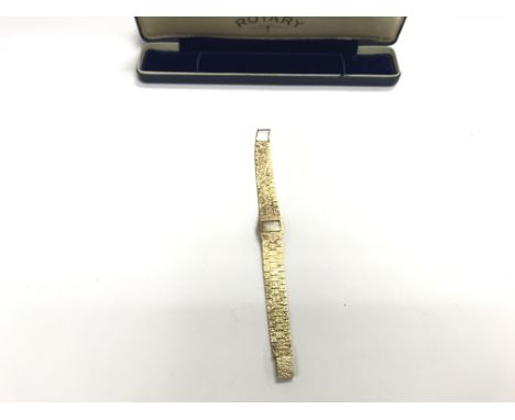 A ladies gold Rotary watch with case.