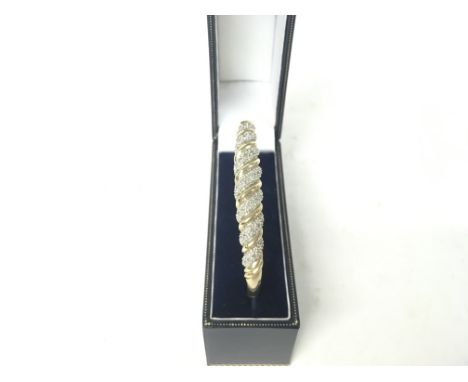 9ct gold bangle in a box. 10.93g total.
