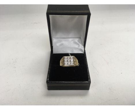 A gents 9ct gold 9 stone set signet ring. Approx 3.5g and approx size R.