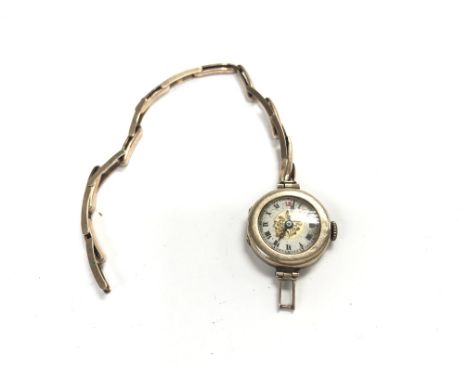 A vintage 9ct gold watch A/F. 12.34g total.