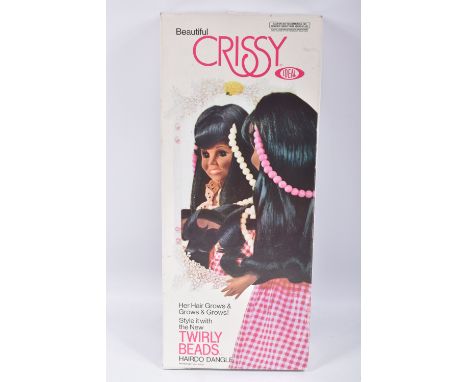 A BOXED IDEAL BEAUTIFUL CRISSY TWIRLY BEADS DOLL, reference 1214-6, doll featuring a pink and white dress, packaged doll in p
