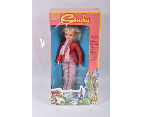 A BOXED SINDY DOLL, in a Exinmex Mexico box, wearing a red jacket, chequered red and white scarf and trousers, box numbered 2