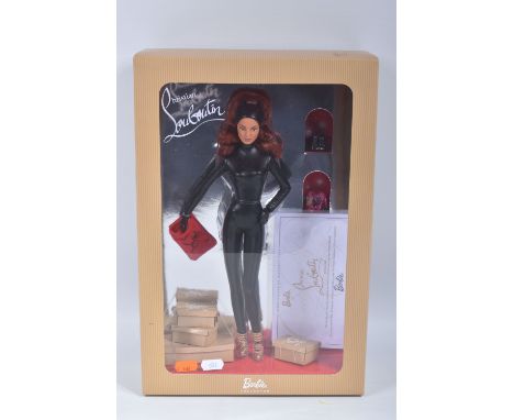 A BOXED MATTEL BARBIE COLLECTOR BARBIE BY CHRISTIAN LOUBOUTIN DOLL, No.N6599, appears complete and in very good condition, lo