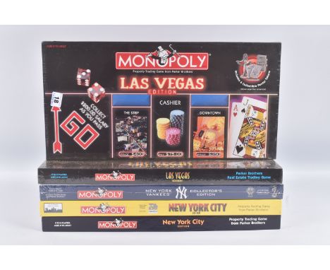 FOUR BOXED US CITY USAOPOLY MONOPOLY SETS, to include a sealed 2001 New York City, a unsealed 1998 New York Edition, a sealed