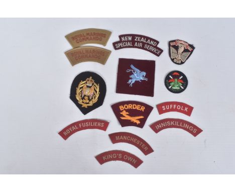 A VARIED AND RARELY SEEN NUMBER OF UNIT PATCHES AND SHOULDER TITLES , to include Royal Marines Commando, Pegasus right facing