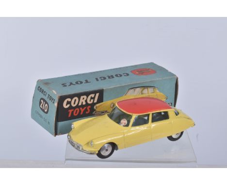 A BOXED CORGI TOYS CITROEN D.S. 19 CAR, numbered 210, lemon body, red roof, grey base, added tax disc in window, black tyres,