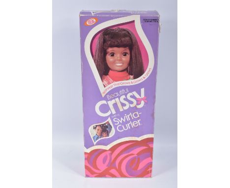 A BOXED IDEAL BEAUTIFUL CRISSY SWIRLA-CURLER DOLL, reference 1111-4, doll featuring a pink and white outfit, with a hair curl