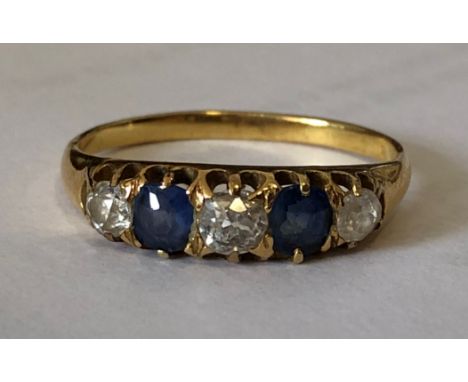 LADIES YELLOW METAL THREE DIAMOND AND TWO SAPPHIRE RING SIZE T 3.8g APPROX