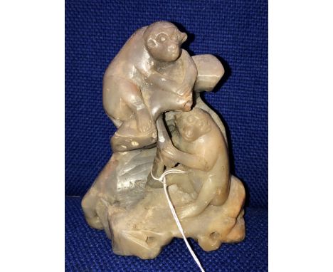 LIGHT GREEN SOAPSTONE CARVING OF TWO PLAYFUL MONKEYS