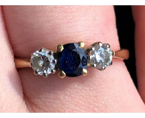 18CT GOLD  SAPPHIRE AND TWO DIAMOND RING 3G APPROX SIZE N/O