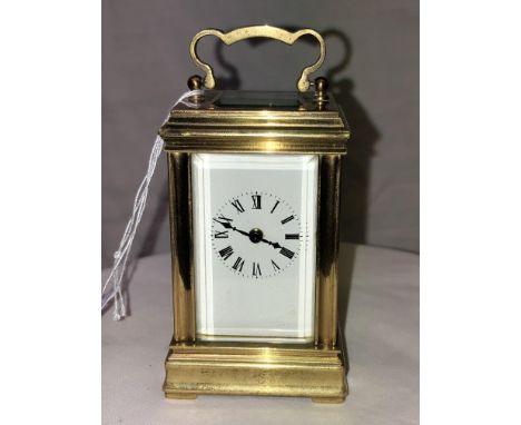 A MINIATURE GILT METAL CARRIAGE CLOCK ACG 278 8CMHIGH