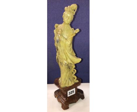 CHINESE LIGHT GREEN CARVED SOAPSTONE FIGURE OF A GUANYIN ON  RUSSET SOAPSTONE TRIFORM BASE 31CMH 