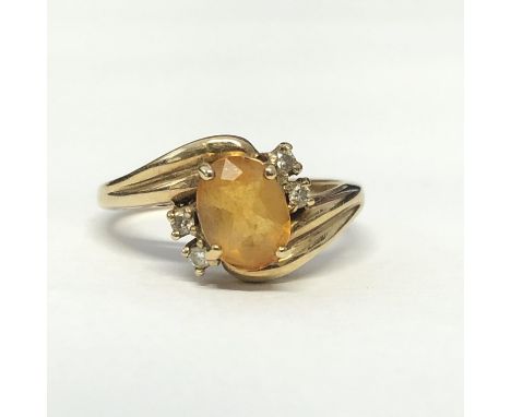 9CT YELLOW GOLD TOPAZ AND DIAMOND CROSSOVER RING 3.8G APPROX SIZE M 