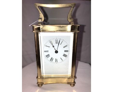 Lot - A SWISS POLISHED BRASS CARRIAGE CLOCK WITH ALARM, MOVEMENT BY MATTHEW  NORMAN, NUMBERED 1754, ELEVEN JEWELS, 20TH CENTURY