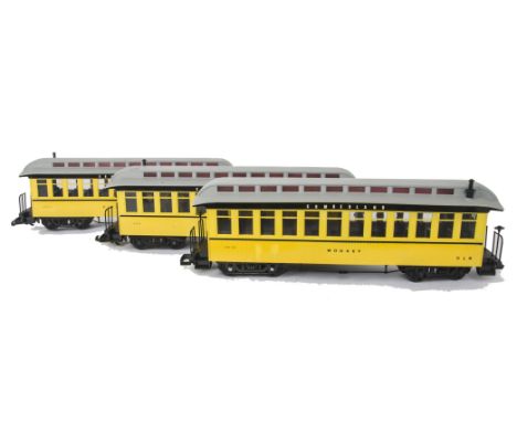 Modified Bachmann G Scale Coaching Stock, three American 'Wild-West'-style coaches in yellow, all retouched in 'Cumberland Li