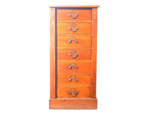 Light oak Wellington chest, fitted with seven drawers, W52cm x D38cm x H106cm.