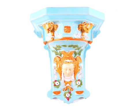A Brownfield majolica wall bracket, modelled with classical mask and lion head design to underside, .stamped 'Brownfield', 25