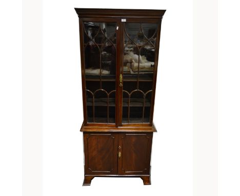 Glazed display bookcase cabinet, moulded cornice above a pair of glazed cupboards, enclosing three adjustable shelves, above 