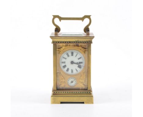 Small French brass cased carriage clock, ivorine chapter ring, subsidiary dial, cast with cherubs and sphinxes, platform esca