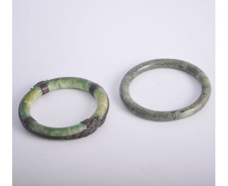 Metal mounted Jadeite bangle, and another Jadeite bangle. (2)
