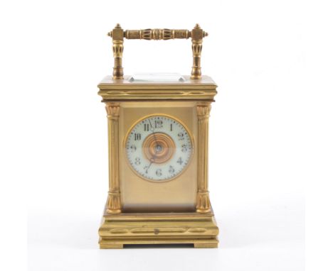 French brass cased carriage clock, ivorine chapter ring with Arabic numerals, platform escapement, striking on a gong, 17cm.