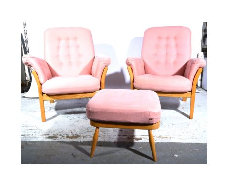 Ercol, two 'Saville' easy armchairs, shape 750, pink button pads, (plus additional floral upholstered seat pads), applied gil