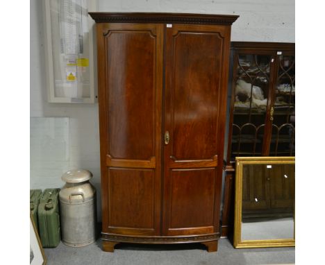 Early 20th Century bow fronted mahogany wardrobe, panel doors, full height doors, raised on bracket feet, W115cm x D55cm x H2