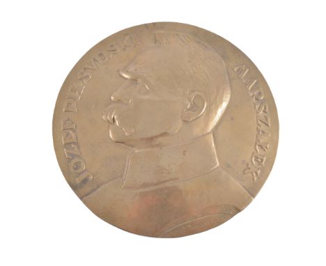 A brass portrait plaque, Jozef Pilsudski, Marazalek, after Aumiller, diameter 36cm.