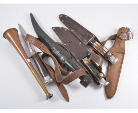 Brass mounted copper hunting horn, 24cm; an Eastern horn handle knife in a leather sheath; and three other knives. (5)