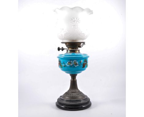 Victorian oil lamp, turquoise tinted glass reservoir, enamelled with floral decoration, with later frosted glass shade, on fl