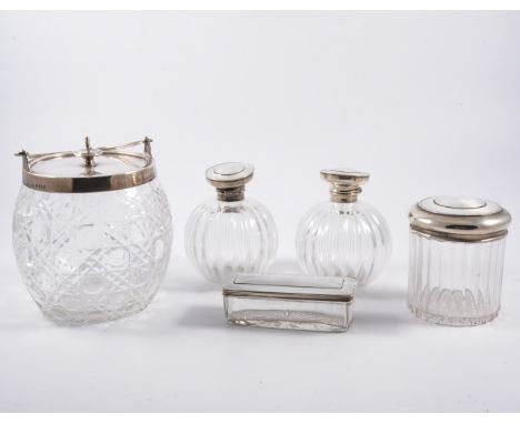 A silver mounted cut glass biscuit barrel, swing handle, by Elkington & Co, Birmingham, 1907, 15cm, a pair of glass scent bot