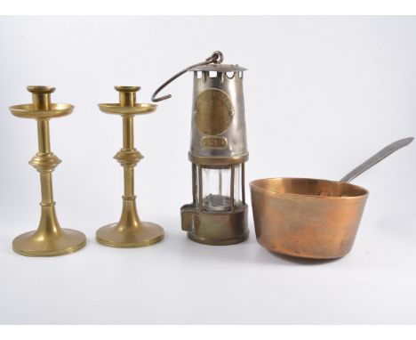 Pair of Arts and Crafts style brass candlesticks, height 20cm, a tobacco jar, a mallet, brass saucepan, planters, a small hay