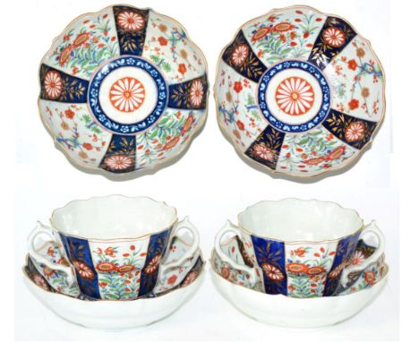 A Pair of Worcester Porcelain Chocolate Cups and Saucers, circa 1775, painted with the Rich Queens pattern, seal marks in und