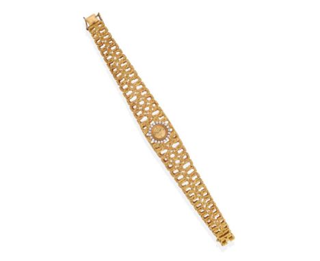 A Lady's 18ct Gold Diamond Set Wristwatch, signed Omega, circa 1970, lever movement, gold coloured textured dial with baton m
