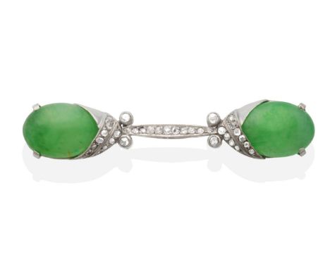 An Art Deco Jade and Diamond Brooch, two oval jade cabochons in claw settings to a scroll bar set throughout with rose cut di