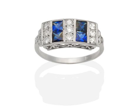 A Sapphire and Diamond Ring, a rectangular top set with square cut sapphires spaced by groups of old cut diamonds, to diamond