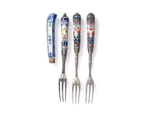A Pair of French Porcelain-Handled Dessert Forks, probably St Cloud, circa 1730, of tapering cylindrical form, painted in und