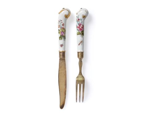 A Chelsea Porcelain-Handled Dessert Knife and Fork, circa 1755, painted with insects and flowersprays, gilt blade and tines, 