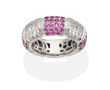 A Pink Sapphire and Diamond Hoop Ring, bands of alternating pavé set round cut pink sapphires and round brilliant cut diamond