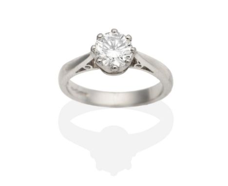 A Platinum Solitaire Diamond Ring, a round brilliant cut diamond in a claw setting, to tapering shoulders, estimated diamond 