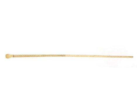 A Bone Walking Stick, 19th century, the pommel with ebonised panel on an engine turned shaft, 84cm long