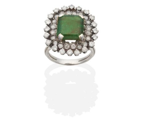 An Emerald and Diamond Cluster Ring, an octagonal cut emerald within a two tier border of eight-cut and round brilliant cut d